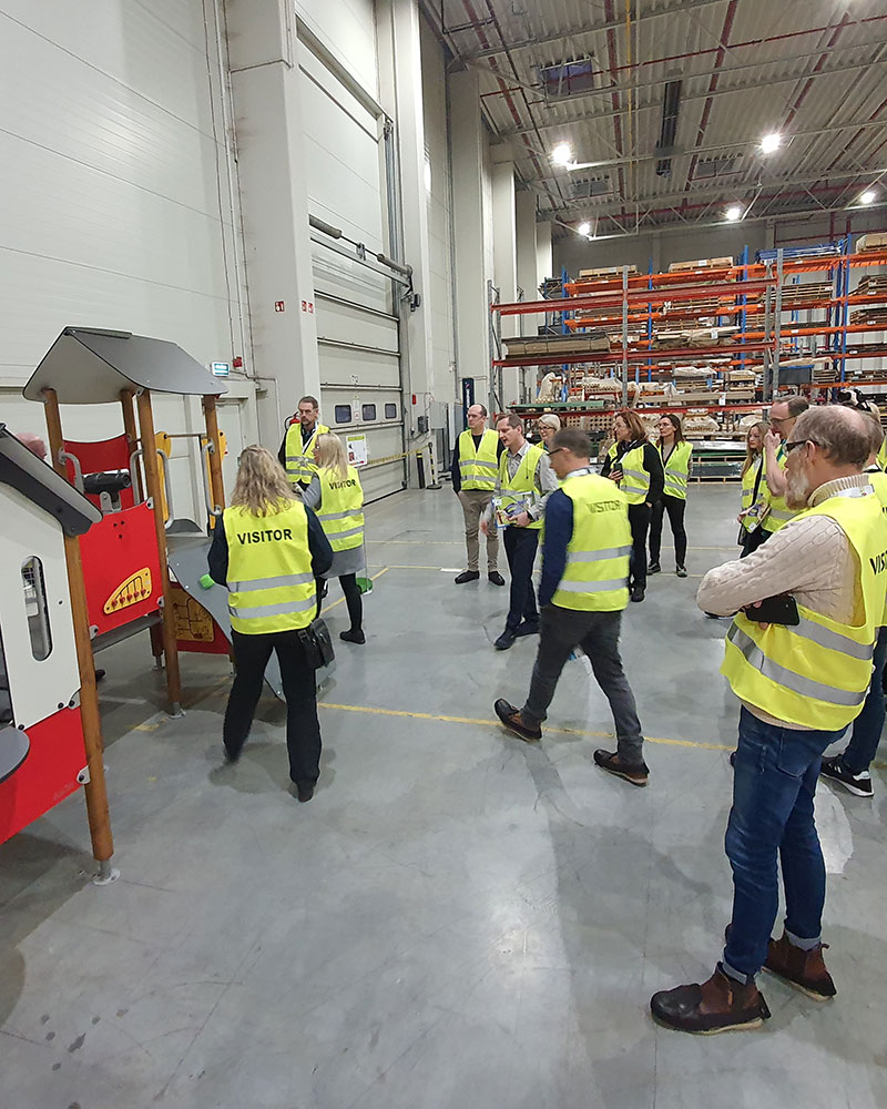 A group of people taking a tour in our factory in Poland.